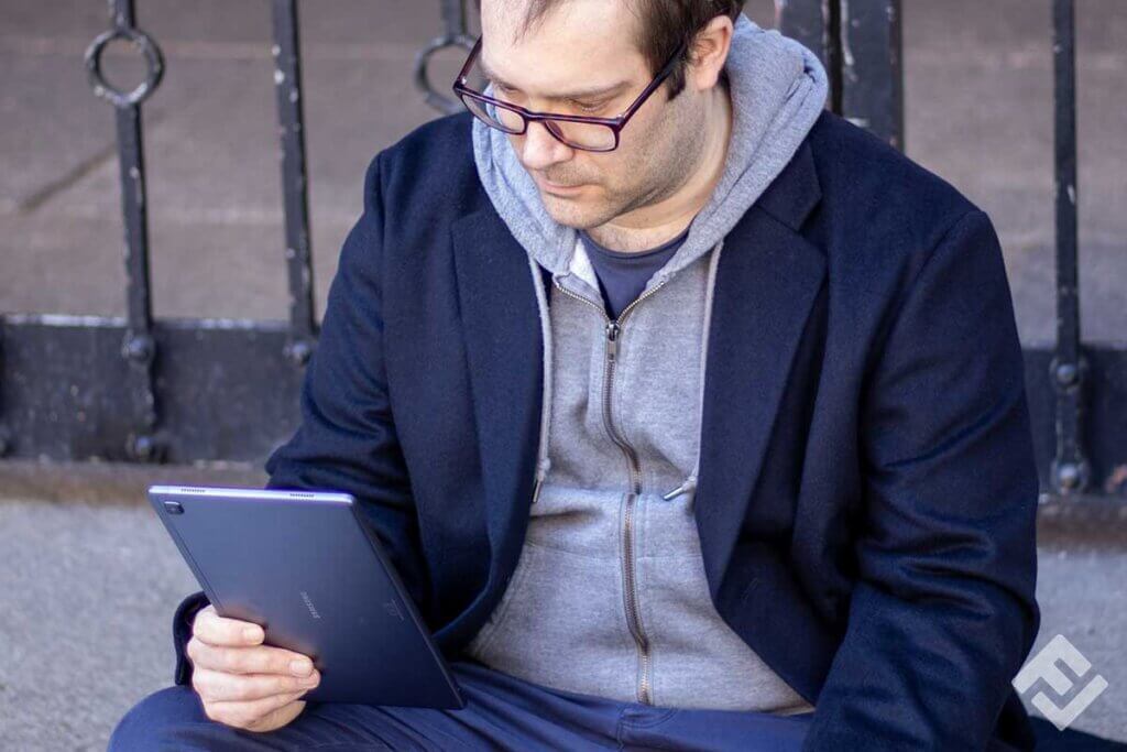 man looking at tablet