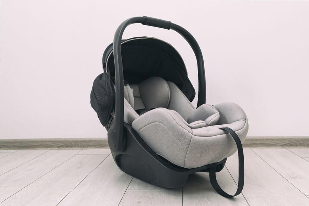 Empty baby seat with folded-up carrying handle