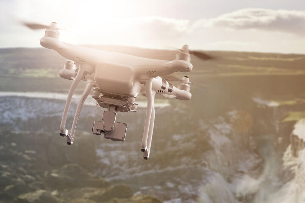 Camera drone flies over a waterfall