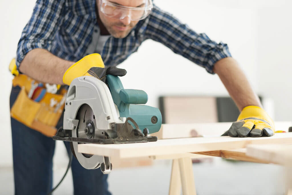 Carpenters work with circular saws