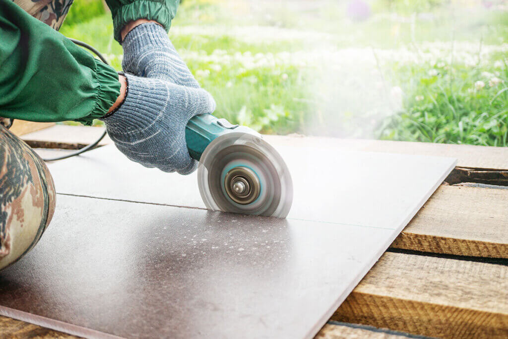 Angle grinder cuts a plate