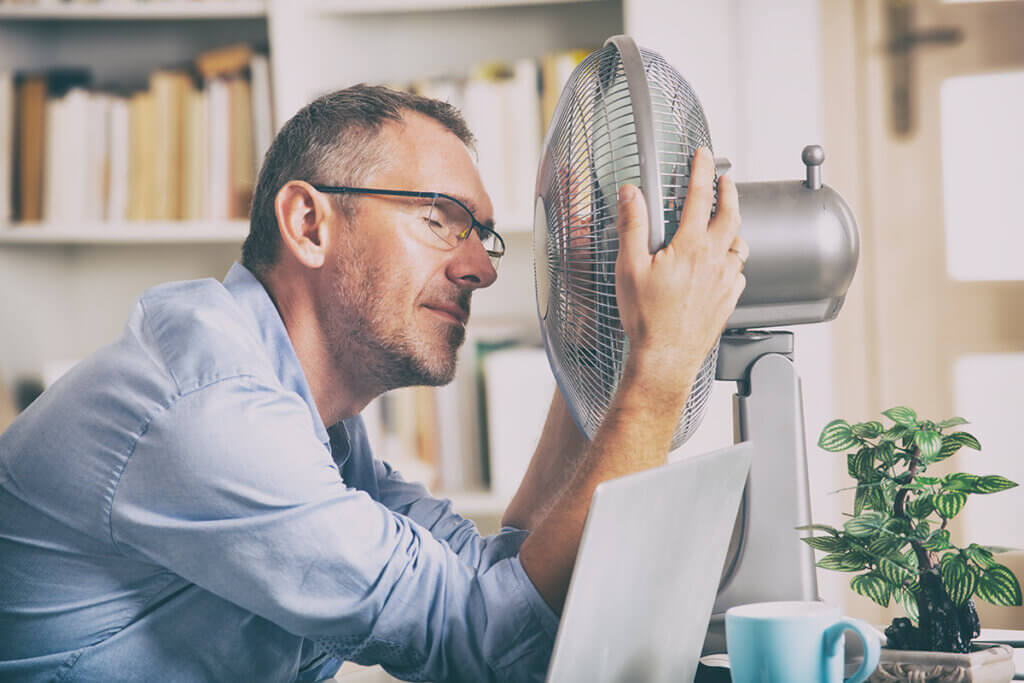 man in front of fan in office