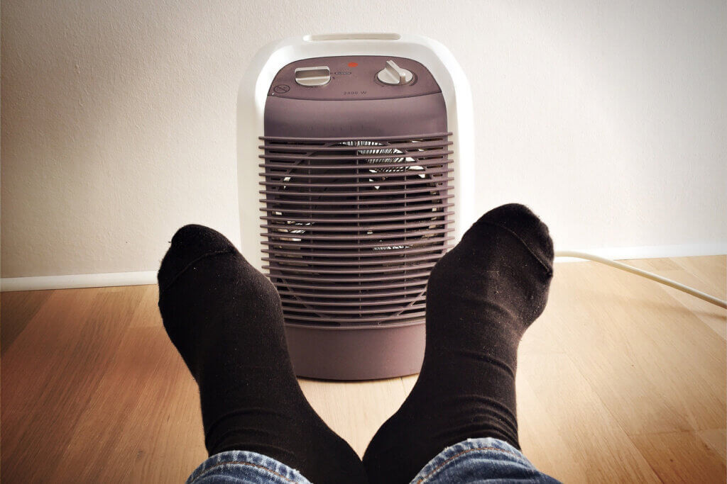 Warm feet in front of fan heater