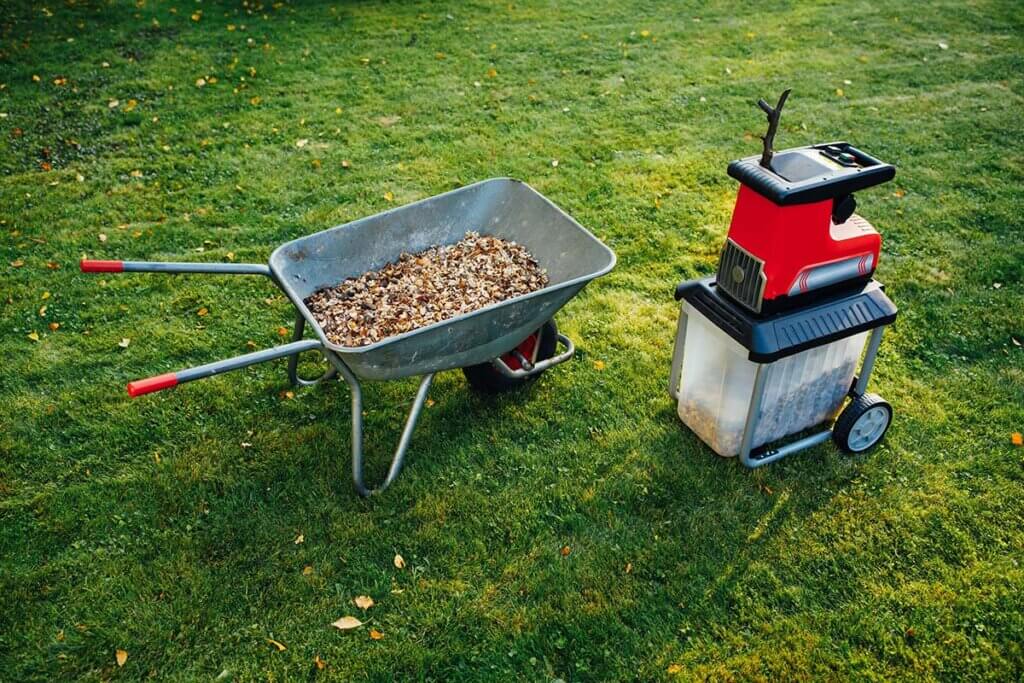 Wheelbarrow with mulch and shredder