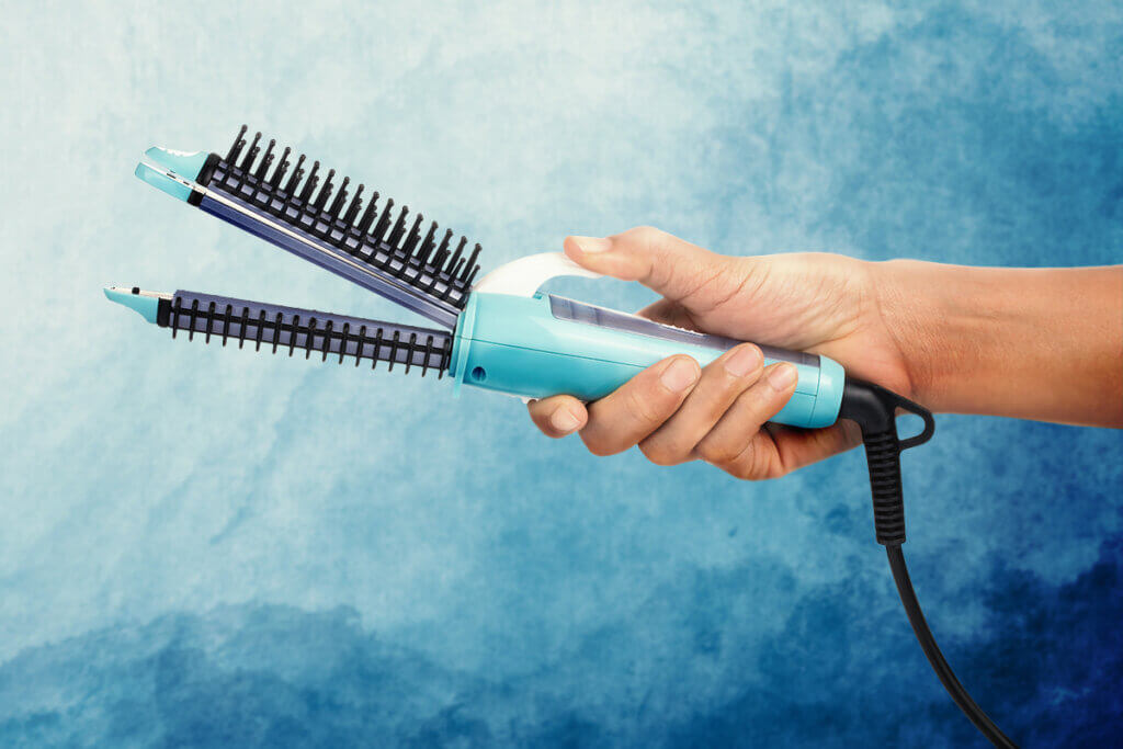 Hair dryer brush with straightener function
