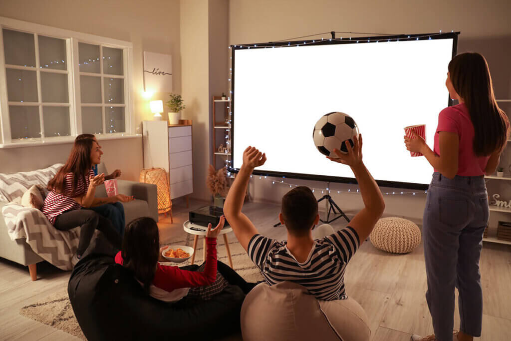 people using a projector in the living room
