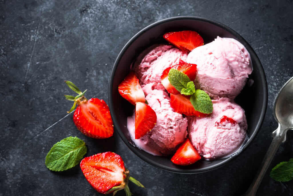 bowl with strawberry ice cream and strawberries