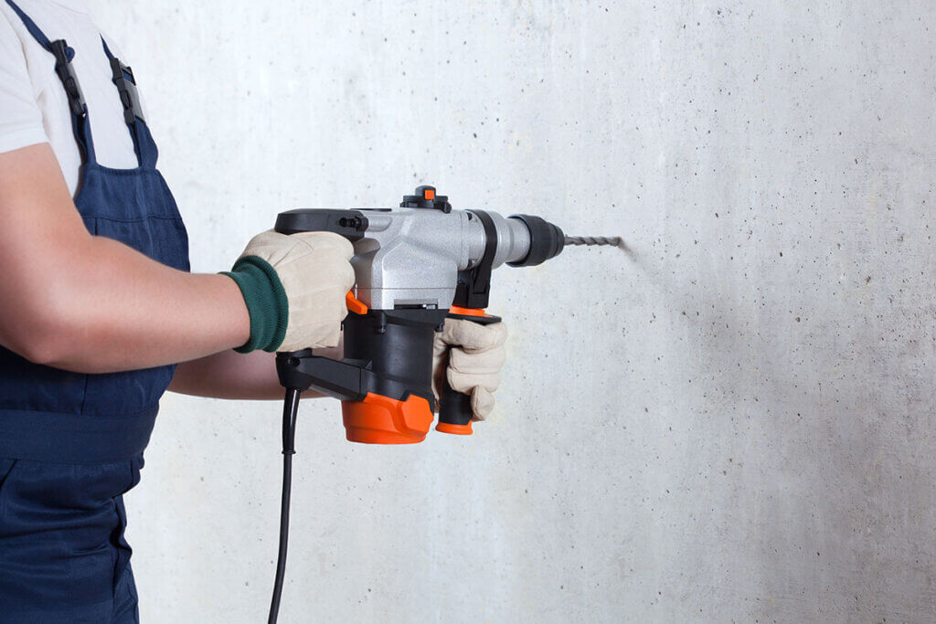 Drilling into walls with a hammer drill