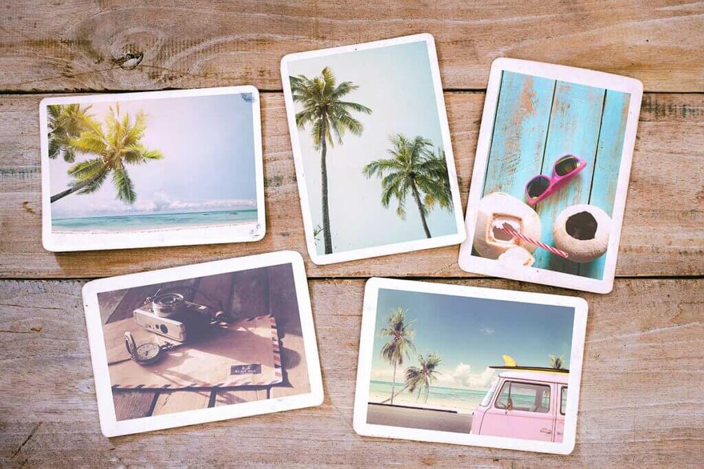 instant camera summer pictures lie on wood background