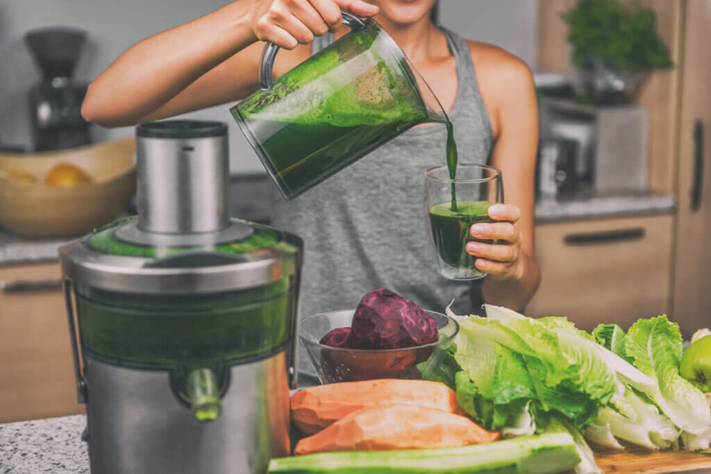 woman fills glass with juice