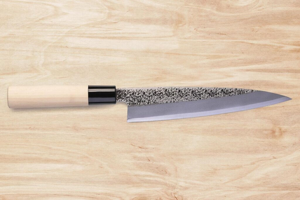 stainless steelknife on a wooden background