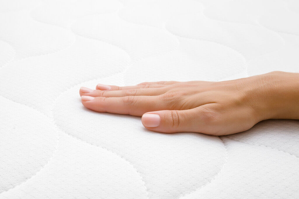 Put your hand on the mattress topper