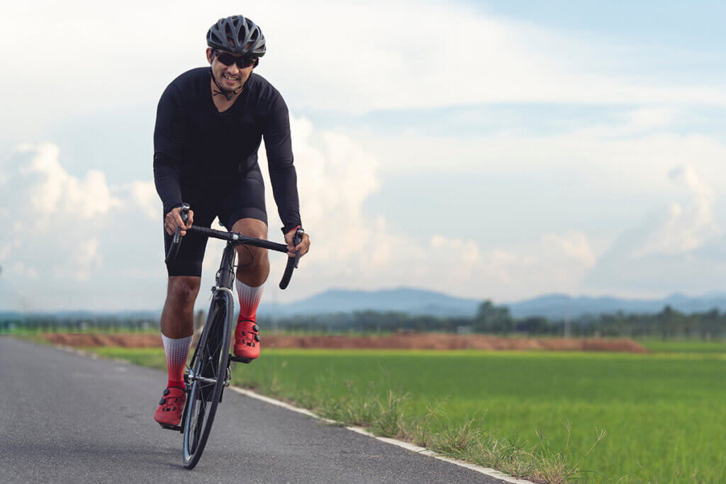 Cyclist with helmet on the road