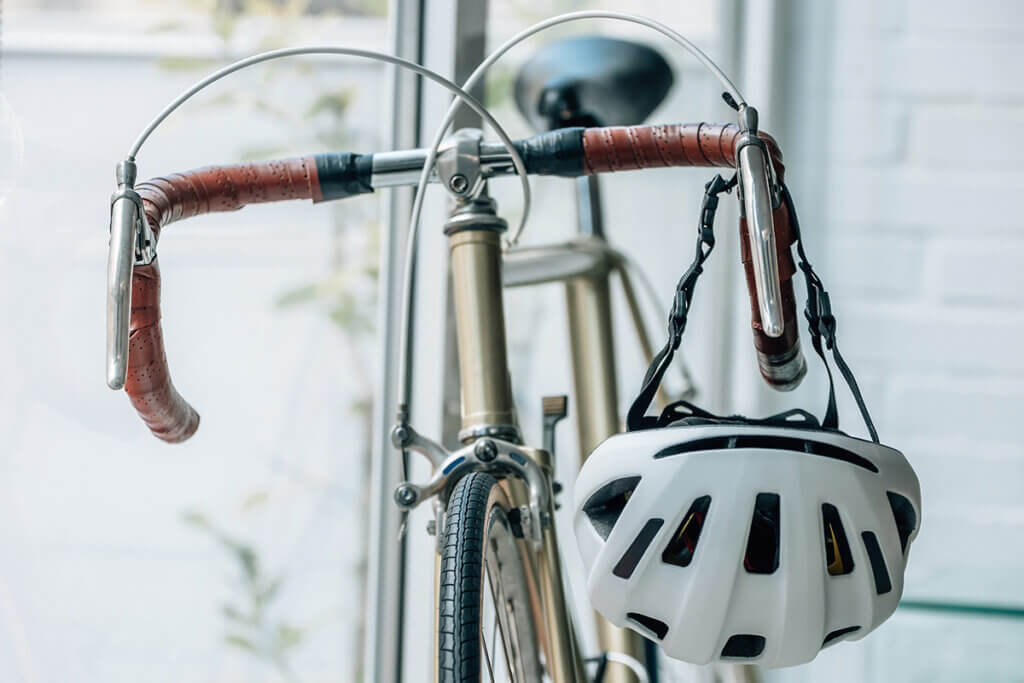 Bicycle helmet on the handlebars of a road bike