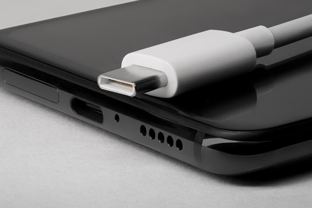 smartphone bottom with usb-c charging port and associated cable