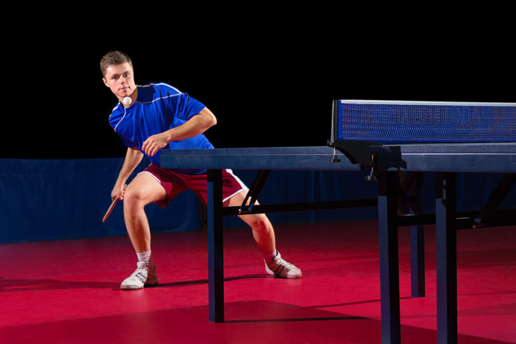 Professional defends ball at table tennis
