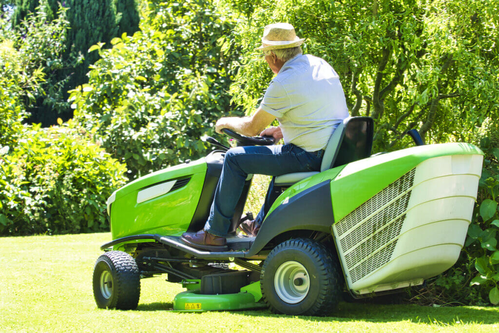 Petrol lawnmower senior on mobile lawnmower
