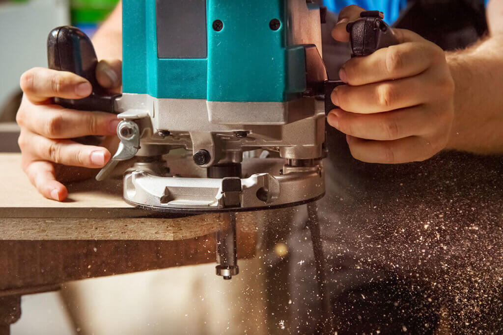 Person working with router machine