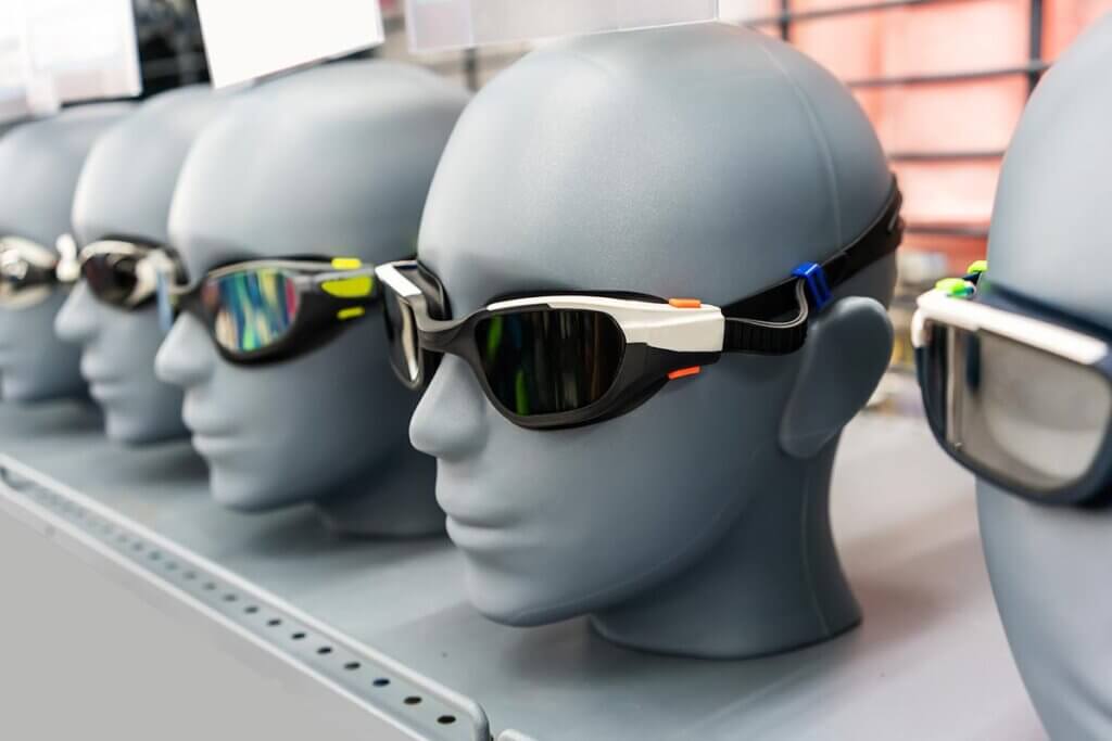 Various swimming goggles on model heads