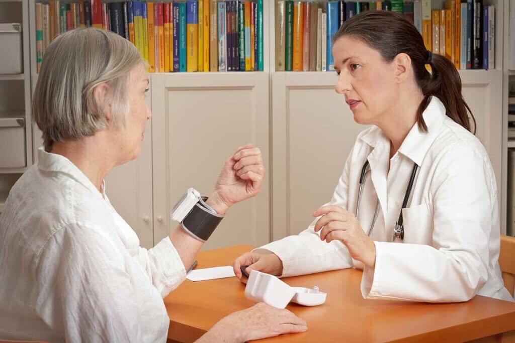 doctor talks to patient